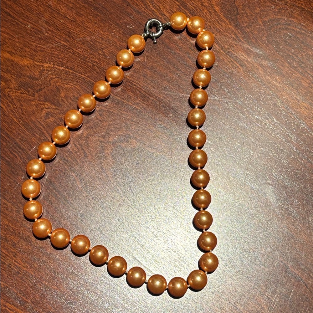 Stylish peach coloured pearls large pearls